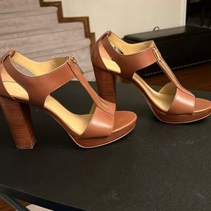 Brown Micheal Kors size 9 platform with a heel sandal.